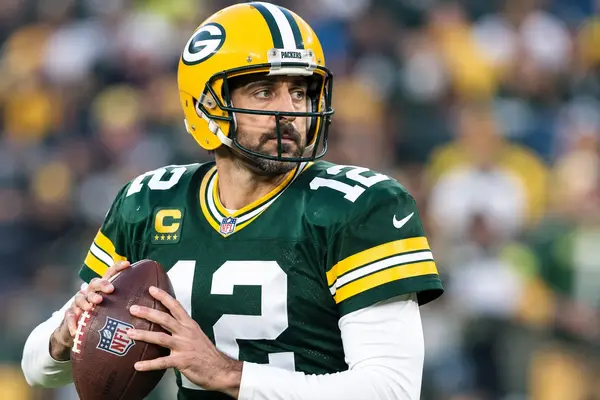 Aaron Rodgers wearing a Green Bay Packers football uniform